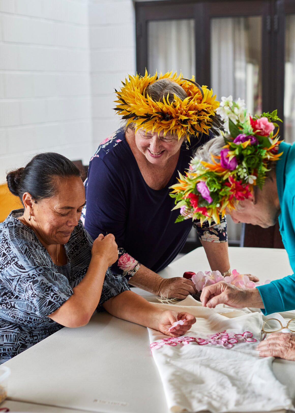 Art teacher, Urarii Ruatoe, makes creative use of
flowers from a lei for a pillow cover