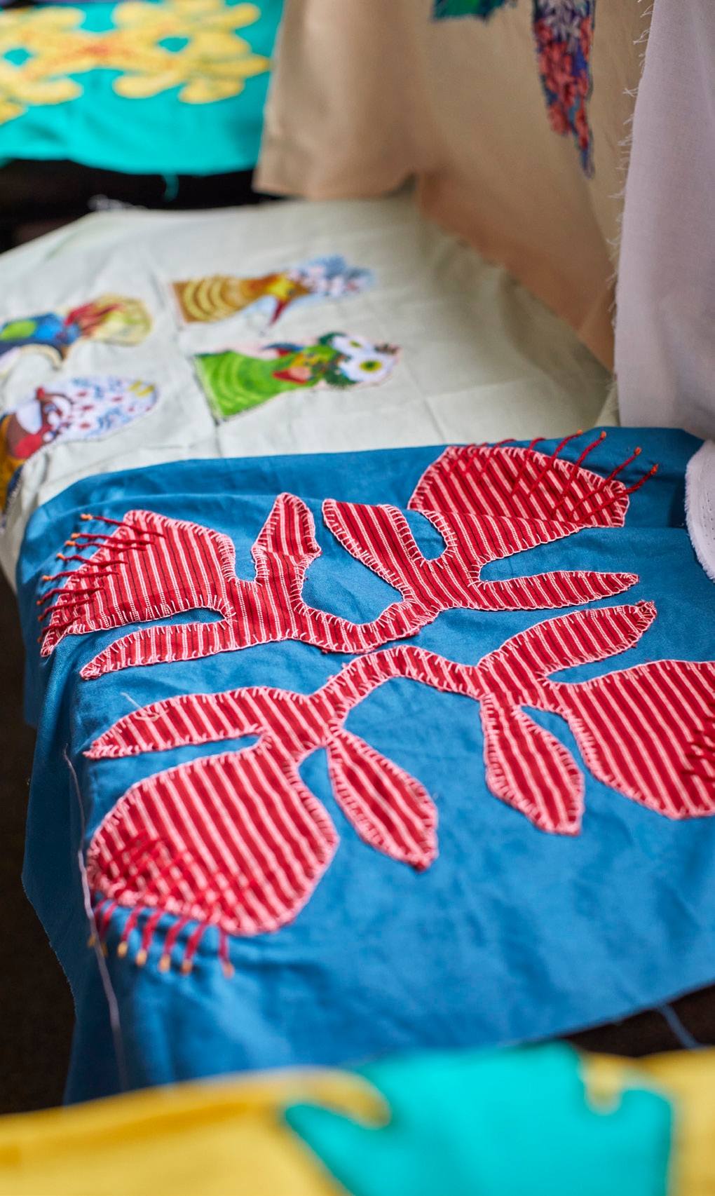 Glenys Libby stitched different New Zealand
designs – including ferns and pohutukawa – onto
squares which were sewn together as a special
quilt to take to her son in South Korea