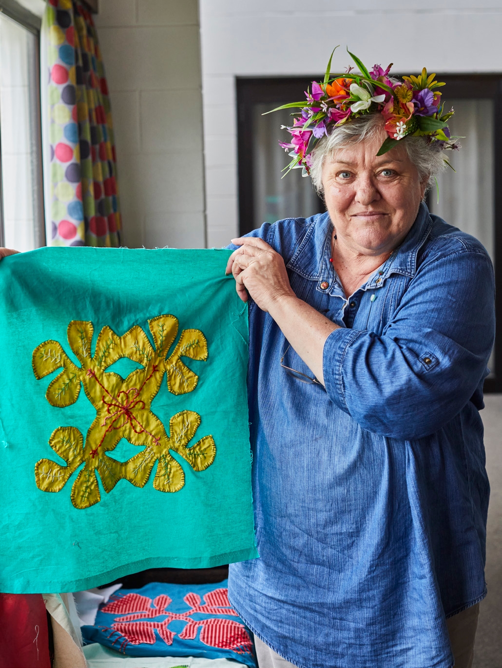 Glenys shows one of the tivaevae squares of
flowers which made up her quilt