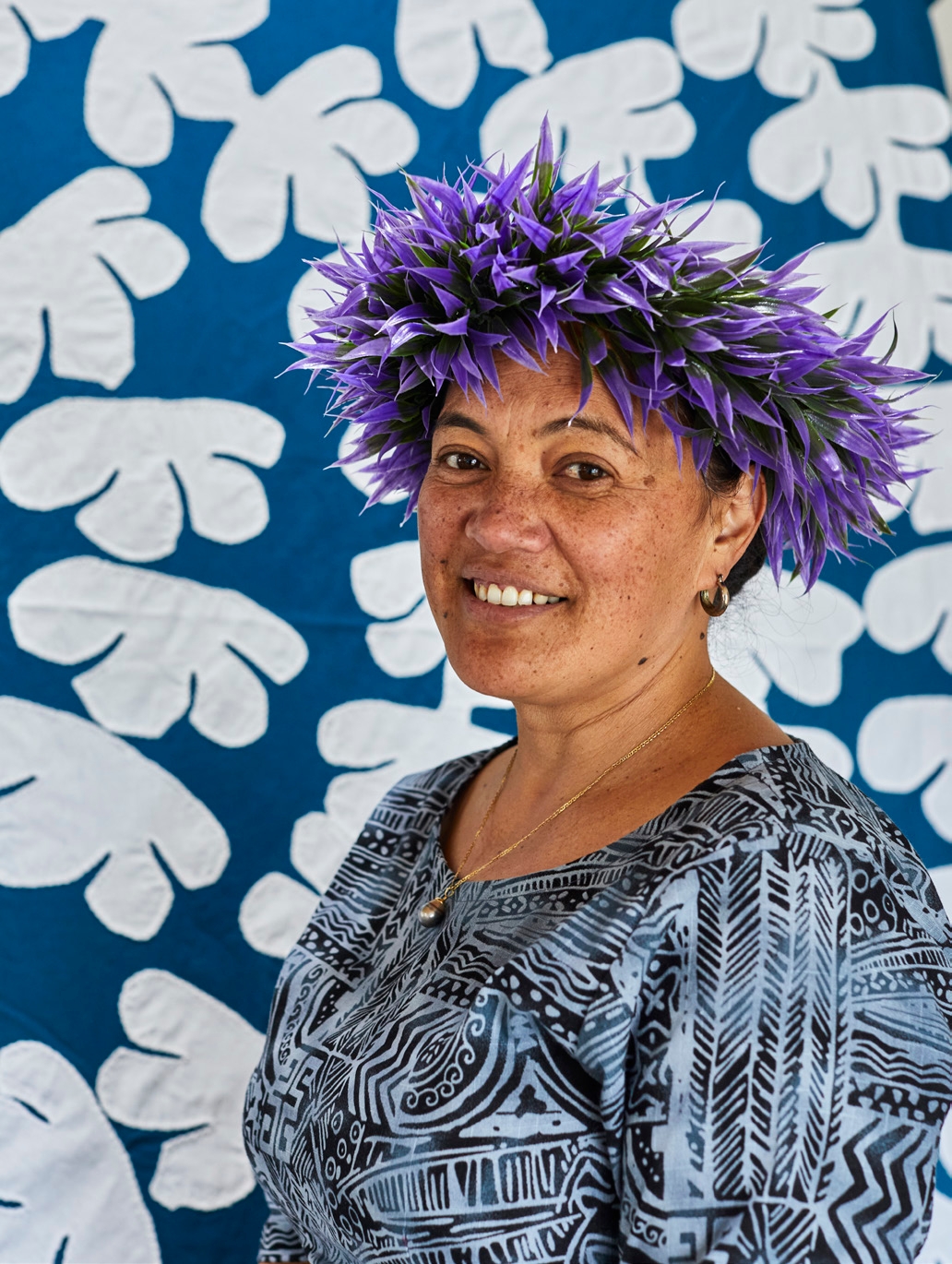 Urarii designed her own blue and white
quilt with its continuous flower pattern